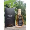 Cocktail Intense EDP 50 ml — товар в стилизованной композиции; очень крупный план; среди зелени; самый широкий кадр