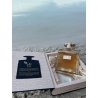 Lattafa Perfume Riqqa EDP 100 ml — product in een gestileerde setting; zeer nabije close-up; op een houten oppervlak
