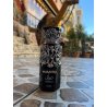 Fragrance World Diwani Cairo EDP 100 ml — produktas stilizuotoje aplinkoje; stambus planas; žalumos apsuptyje