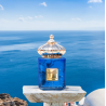 Matin Martin SANTORINI EDP 100 ml — товар в стилизованной композиции; очень крупный план; у воды
