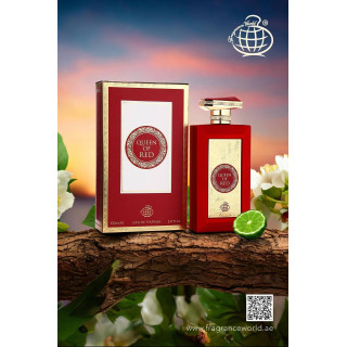 Fragrance World Queen of Red EDP 100 ml — товар в стилизованной композиции; очень крупный план; среди зелени; самый широкий кадр