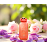 Fragrance World Elysia Lychee EDP 100 ml — toode stiliseeritud keskkonnas; väga lähivõte; valgel taustal