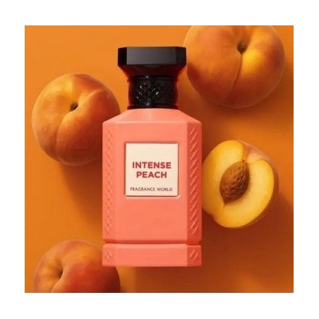 Fragrance World Intense Peach EDP 80 ml — товар и упаковка; очень крупный план; с ингредиентами аромата; самый близкий кадр