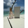 Fragrance World Elysia Lychee Fizz EDP 50 ml — товар в стилизованной композиции; очень крупный план; у воды
