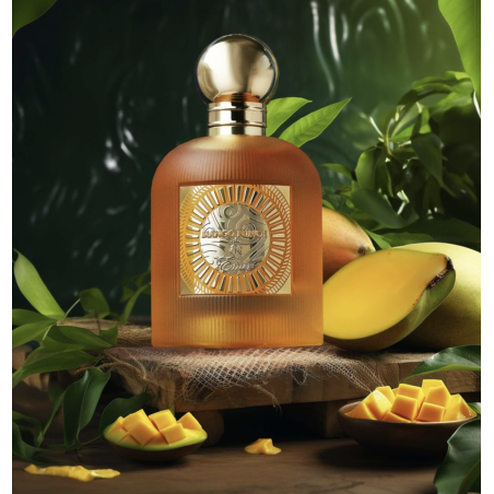 Paris Corner Mango Punch EDP 100 ml — товар в стилизованной композиции; очень крупный план; среди зелени