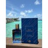 Fragrance World Blue Magician EDP 100 ml — товар в стилизованной композиции; очень крупный план; у воды; самый широкий кадр