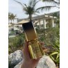 Fragrance World Cosmic Tonka EDP 100 ml — produkt w stylizowanej aranżacji; bardzo bliskie ujęcie; na kamiennej powierzchni