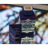 Lattafa Perfume Bade'e Al Oud Amethyst EDP 100 ml — produkto pakuotė; stambus planas; baltame fone; artimiausias kadras