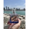 Fragrance World Barakkat Aqua Stellar 100 ml — toode stiliseeritud keskkonnas; väga lähivõte; vee ääres; kõige laiem kadreering