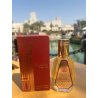 Barakkat Rouge 540 Extrait 50 ml — товар в стилизованной композиции; очень крупный план; на открытом воздухе; самый широкий кадр