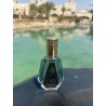 Barakkat Satin Oud EDP 50 ml — товар в стилизованной композиции; очень крупный план; на открытом воздухе; более широкий кадр