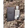 Black Afgano EDP 60 ml — товар в стилизованной композиции; очень крупный план; на каменной поверхности; самый близкий кадр