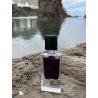 Black Afgano EDP 60 ml — товар в стилизованной композиции; очень крупный план; на каменной поверхности; самый широкий кадр