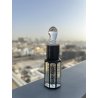 Lost Cherry Arabica 12 ml — товар в стилизованной композиции; очень крупный план; на открытом воздухе; самый широкий кадр