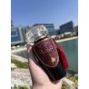 Lattafa Perfume Mohra EDP 100 ml — produit dans une mise en scène; très gros plan; en extérieur