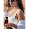 Fragrance World Ebony Fume EDP 80 ml — produktas stilizuotoje aplinkoje; stambus planas; baltame fone; plačiausias kadras