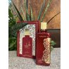 Lattafa Perfume Barez EDP 100 ml — toode stiliseeritud keskkonnas; väga lähivõte; roheluse keskel; kõige laiem kadreering