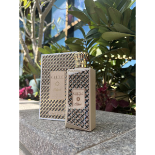 Lattafa Perfume Ajeeb EDP 100 ml — product in a styled setting; tight close-up; among greenery; closest framing