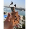 Fragrance World Ace EDP 80 ml — toode stiliseeritud keskkonnas; väga lähivõte; õues