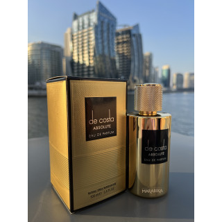 De Costa Absolute EDP 100 ml — товар в стилизованной композиции; очень крупный план; на открытом воздухе; самый близкий кадр