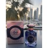 Fragrance World Khulood EDP 100 ml — προϊόν σε στιλιζαρισμένο σκηνικό; πολύ κοντινό πλάνο; ανάμεσα σε πρασινάδα; ευρύτερο κάδρο