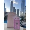 Bab Al Wardi EDP 100 ml — товар в стилизованной композиции; очень крупный план; на открытом воздухе; самый широкий кадр
