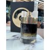 Fragrance World Expose EDP 100 ml — товар в стилизованной композиции; очень крупный план; среди зелени