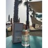 Fragrance World Roses De Mai Jacques Yves EDP 100 ml — produktas stilizuotoje aplinkoje; stambus planas; ant stalo