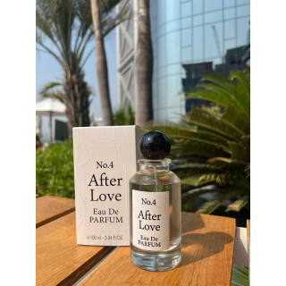 Fragrance World No.4 After Love EDP 100 ml — produkt i en stylad miljö; mycket tät närbild; bland grönska