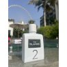 Fragrance World The player 2 EDP 100 ml — товар в стилизованной композиции; очень крупный план; среди зелени