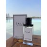 Fragrance World S.A.L.T EDP 100 ml — товар в стилизованной композиции; очень крупный план; на открытом воздухе