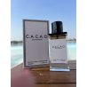 C.A.C.A.O EDP 100 ml — товар в стилизованной композиции; очень крупный план; на открытом воздухе; самый близкий кадр