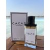 C.A.C.A.O EDP 100 ml — товар в стилизованной композиции; очень крупный план; на открытом воздухе; самый широкий кадр